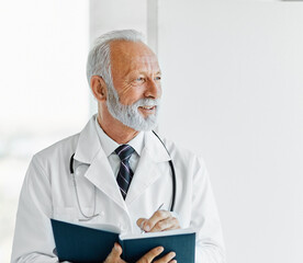 senior elderly gray hair active doctor hospital medical medicine health care clinic office portrait glasses man stethoscope specialist