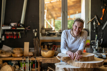 Portrait of confident craftswoman in her workshop
