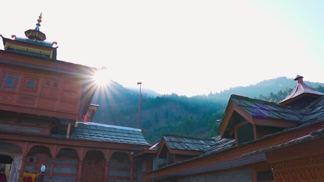 Bhima Kali Temple with mountains in background at Sarahan in Himachal Pradesh in India. Sunstar with temple. Hindu temple in Himachal Pradesh. Travel and holidays. 