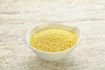 Raw couscous in the bowl
