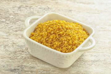 Raw bulgur in the bowl