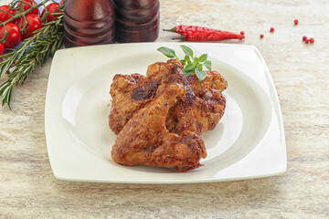 Roasted chicken wings with spicy sauce