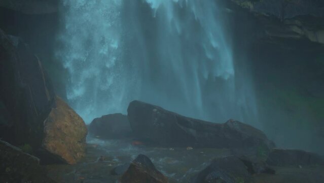 Slow motion shot of the Jogini waterfall at Manali in Himachal Pradesh, India.  View of the Jogini Waterfall during monsoon in Manali. Travel concept