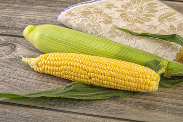 Yellow sweet raw cob corn