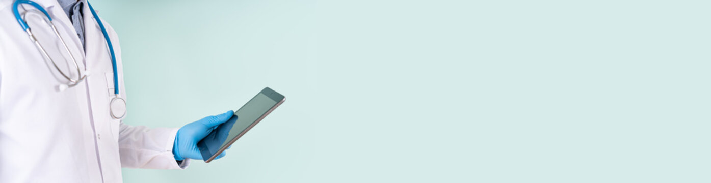 Medical online consultation banner. Male doctor using digital tablet on blue background. Health check up web line. Health care, doctor Prescribes Medicine banner, spicial offer. Copy Space