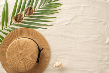 From above, the essence of summer lounging. Top view of stylish sunglasses, sunhat, seashell, and...