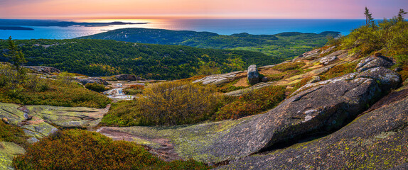 Panorama of the Cadillac Mountain Overlook in Acadia National Park, Bar Harbor, Maine, beautiful expansive vista over glacial rocks at sunrise  © Naya Na