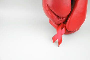 Red ribbon with boxing gloves, wrestling symbol.