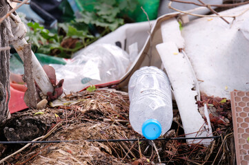 Waste of plastic water bottles on the floor.