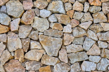 Granite stone wall, pattern of natural gray granite stone wall for background.