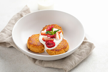 Portion of appetizing russian syrniki pancakes breakfast