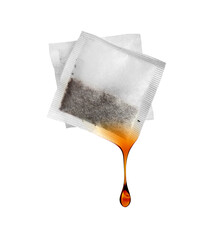 Drop dripping from a tea bag close-up isolated on a white background