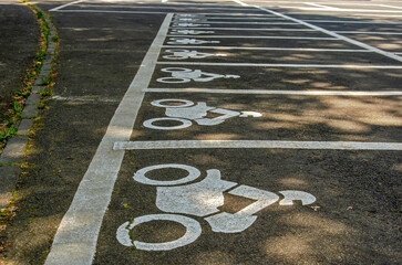 Daun, Germany, May 26, 2023: parking spaces for motorbikes on a parking lot near the crater lakes