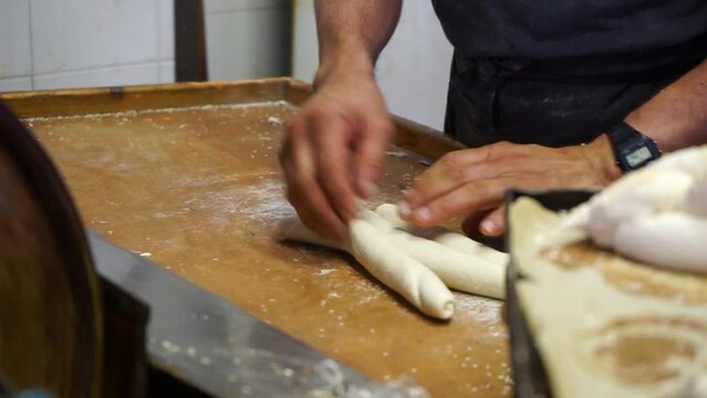 
A baker makes Shabbat challahs