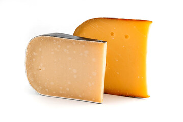 On a white background are two pieces of aged gouda cheese.