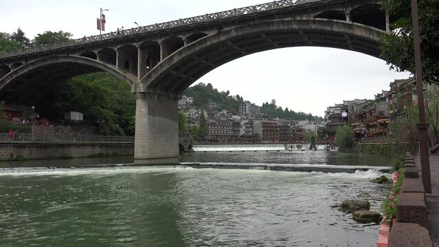 Stone bridge above Tuojiang river in Fenghuang Ancient Town. Xiangxi, Hunan, China.