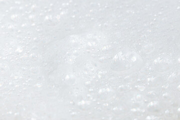 Soap bubbles.Abstract background white soapy foam texture.Shampoo foam with bubbles.Indoors shot.