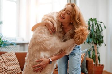 Couple with dog at home