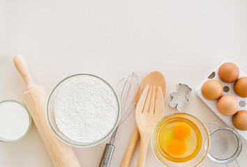 Frame of food ingredients for baking on a gently pink pastel background. Cooking flat lay with copy space. Top view. Baking concept. Mockup.