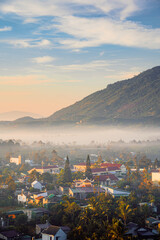 Mountains during dawn. Beautiful natural landscape in the summer time with fog