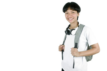 Portrait of a young student with a school bag. young woman pulling forward straps of gray hipster...