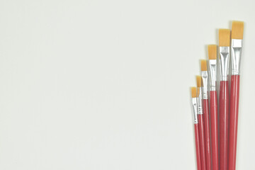 Top view of paint brush on white background with copy space.