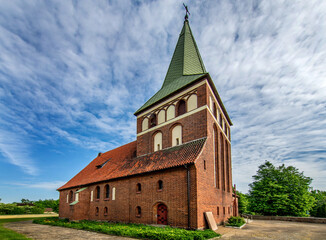 Fototapeta na wymiar General view and close-up of architectural details of the St. Anthony of Padua Catholic Church built in 1911 in Sarnowo, Masuria, Poland.