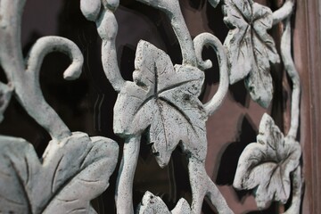 Leafy ivy metal decoration on a fancy gate.