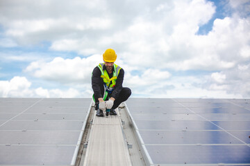 Male engineering teams install solar panels at solar power generating station, Professional engineer installing photovoltaic panel system using screwdriver, green energy and sustainable living