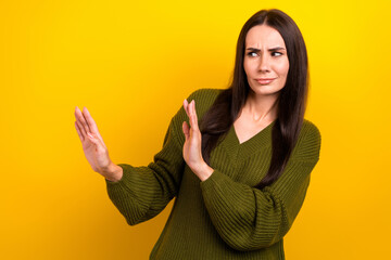 Portrait of unsatisfied lady look arms palms deny reject empty space isolated on yellow color...