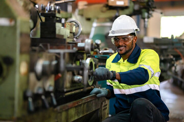 Production engineers are assisting adjusting and maintaining factory machine, Male workers technician examining control the industrial technology tool, professional repair men work in industry plant