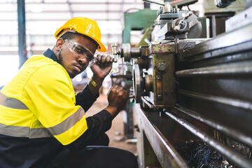 Production engineers are assisting adjusting and maintaining factory machine, Male workers technician examining control the industrial technology tool, professional repair men work in industry plant