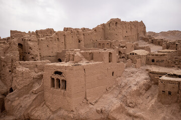 ancient medieval ruins of a city from clay and mud in iran desert fort