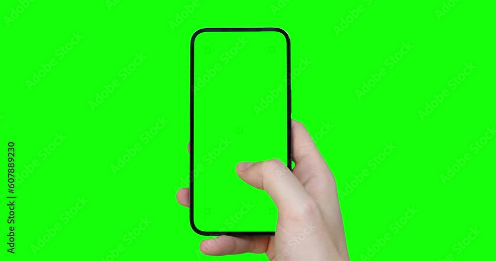 Poster a man's hand holds a smartphone with an empty green screen with tracking markers and scrolls through