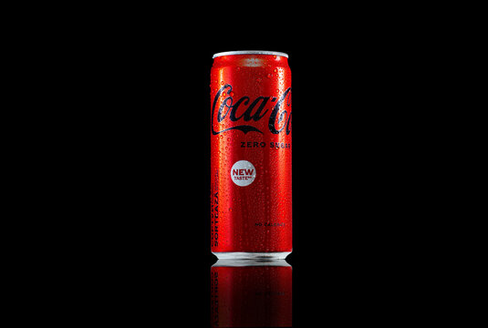 Zaporozhye, UKRAINE - MAY 28, 2023: Coca-Cola zero sugar can with water drops and reflection on black background.