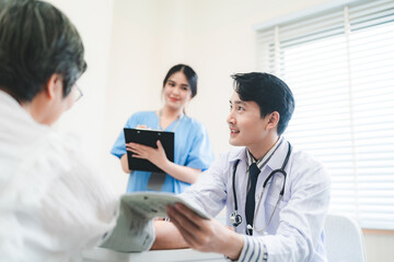 Doctor checking consultation with patient for checkup. work on healthcare paperwork and happiness of medical professional, checklist and report a results in hospital clinic, health insurance business