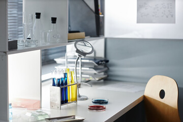 Background image of laboratory equipment on workstation with petri dishes and test liquids, copy...