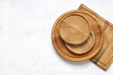 Top view of stack of craft cutting boards on the white kitchen table. Empty space