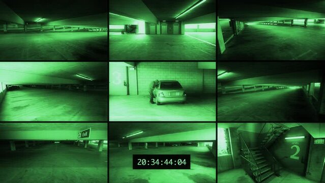 Security camera footage of a car in a parking deck being broken into.