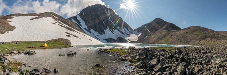 Paddy Peak in northern arctic area during summer time with glacial lake below a stunning rock...