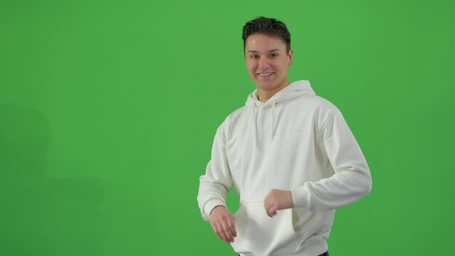 Young good-looking man in a green screen studio - people photography