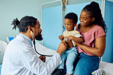 Small black boy during medical examination at pediatrician's office.