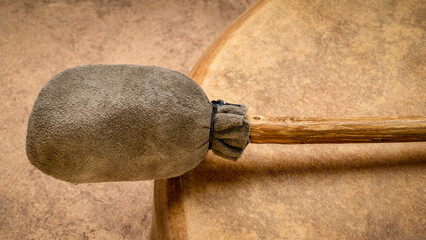 detail of handmade, native American style, shaman frame drum with a beater