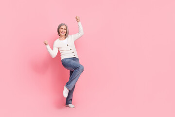 Full size photo of attractive senior woman raise fists lottery winner dressed stylish white clothes...