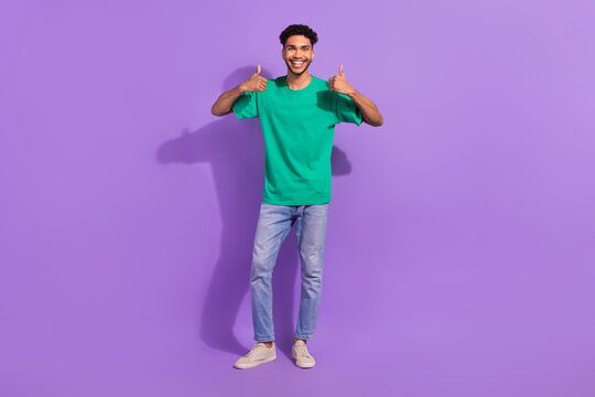 Full body cadre of positive man wear green t-shirt thumbs up high quality clothes from aliexpress isolated on violet color background
