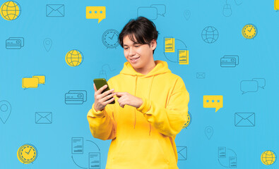 Smiling asian man with phone over diverse digital world icons