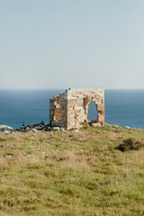 Fototapeta na wymiar Ruins of a house or tower in Salento