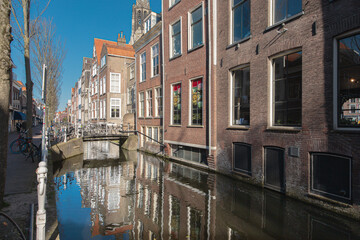 Fototapeta na wymiar Canals and Brick Houses in Old Town Delft, Netherlands
