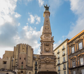 Fototapeta premium Piazza San Domenico Maggiore, in the historic center of Naples. In the center marble obelisk of the San Domenico Maggiore. Italy
