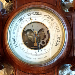 Vintage wooden barometer and thermometer